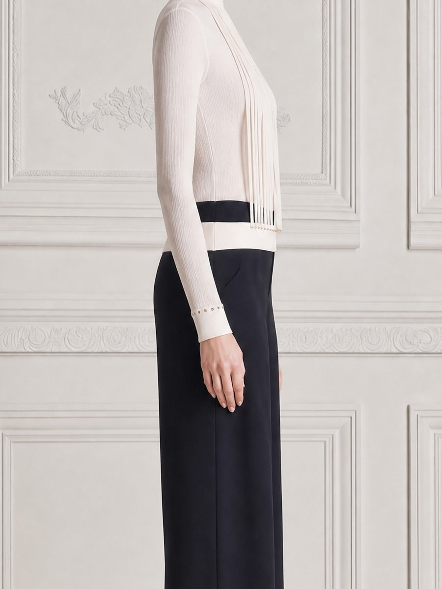LEGNANO - Top bianco con frange e pantaloni neri ampi