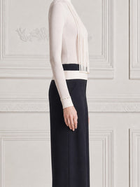 LEGNANO - Top bianco con frange e pantaloni neri ampi