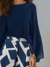 PIZZONI - Set due pezzi blu navy con maniche velate e pantaloni geometrici