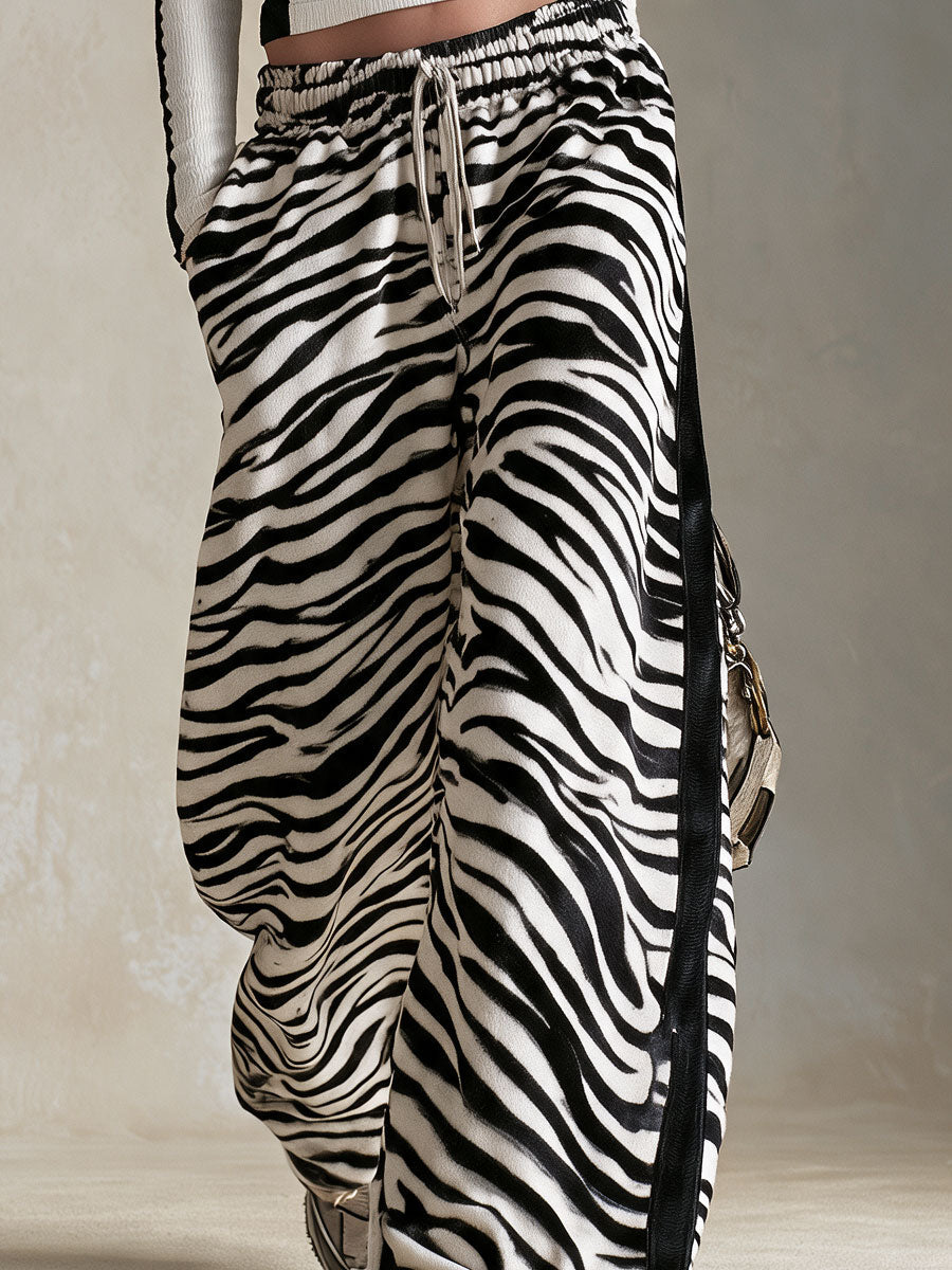 URURI - Set due pezzi maglia bicolore e pantaloni effetto zebra