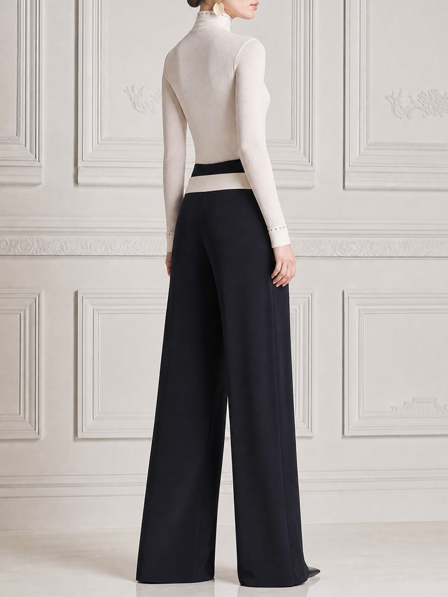 LEGNANO - Top bianco con frange e pantaloni neri ampi