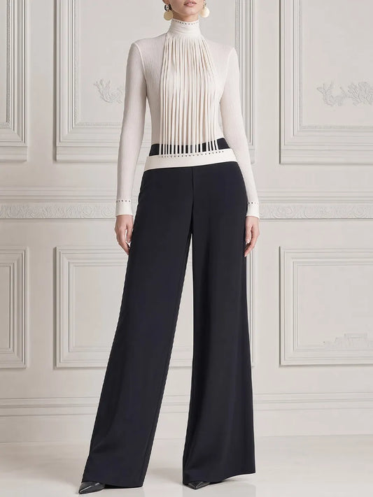 LEGNANO - Top bianco con frange e pantaloni neri ampi