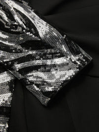 RONDANINA - Tuta nera con paillettes, scollo V e maniche lunghe