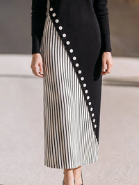 PORCARI - Maxi dress nero a collo alto con bottoni asimmetrici