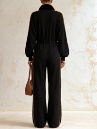 CHIUSI - Tuta nera color block con zip e gamba ampia
