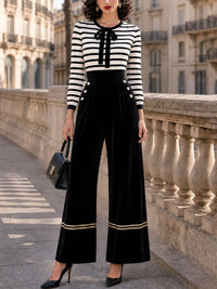 GRISELDA - Jumpsuit vintage in velluto a righe con fiocco al collo